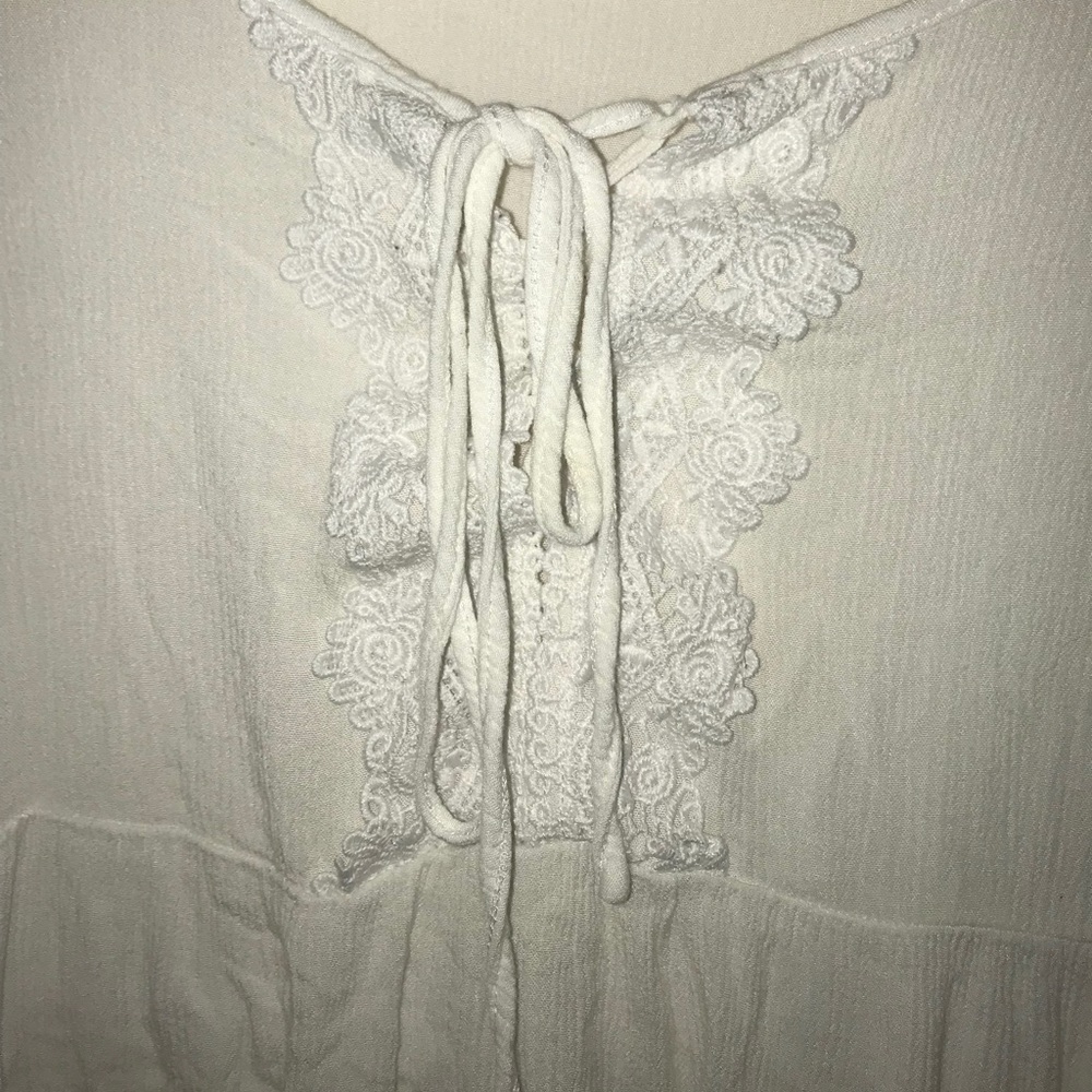 White long sleeve with flowy sleeves